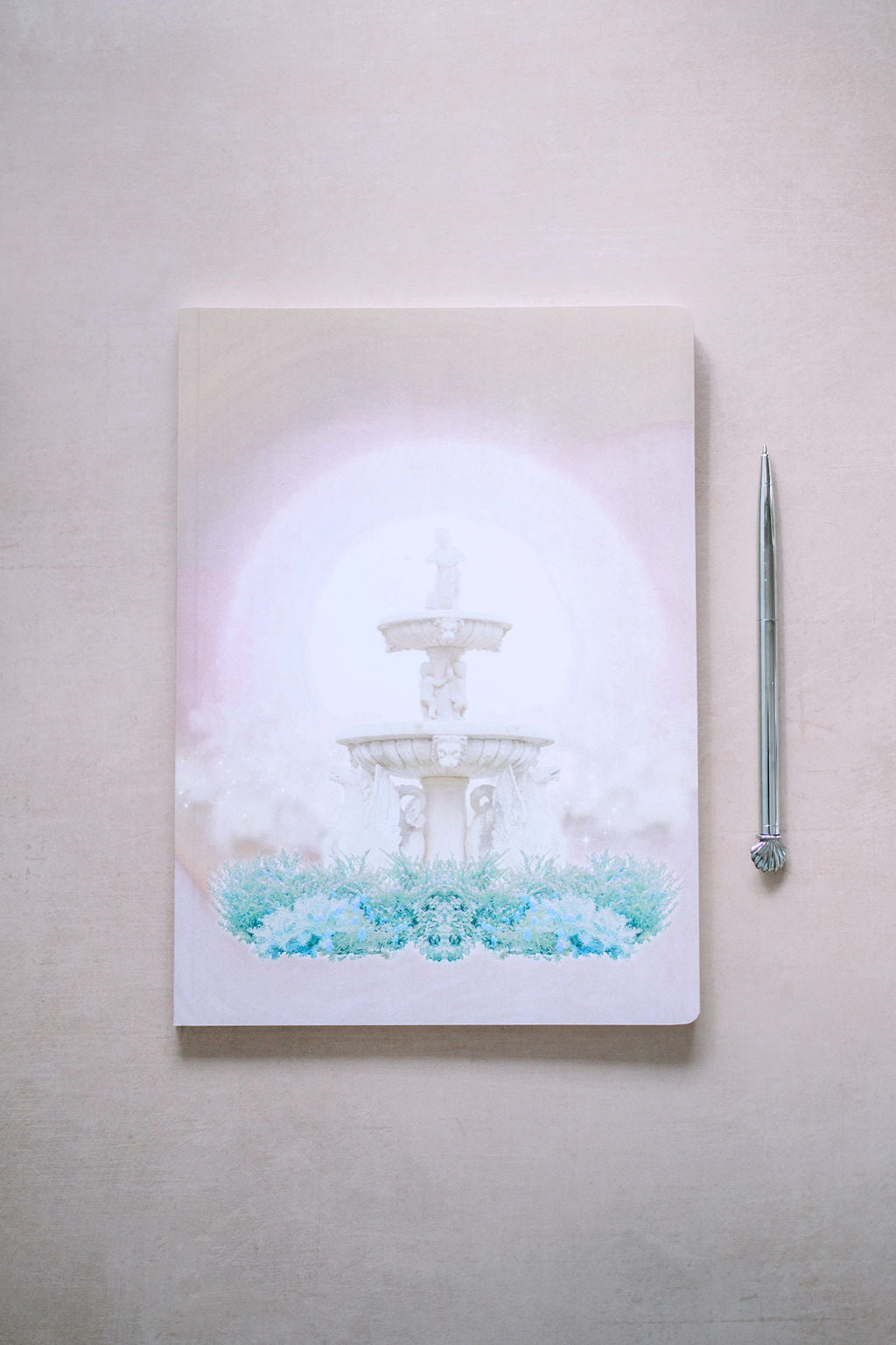 Fountain of Wealth  This journal is intended to help you notice all of the prosperity that is available to you in each moment so that you can consistently receive more of it into your life.   From the velvety-soft cover to the creamy pages to the potent cover design, this journal is the perfect place to record magical manifestations of wealth or dream up new ways for abundance to flow to you.